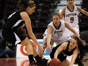 Carleton Ravens' Elizabeth Roach, centre, is the OUA East women's basketball player of the year. Darren Brown/Ottawa Sun