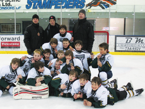 The Portage Atom AA team celebrates a bronze medal win at the Atom AA rural provincials Mar 2. (Submitted photo)