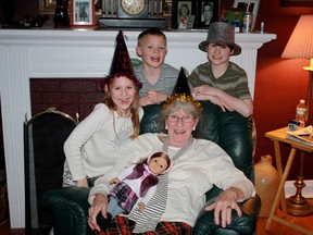 Columnist Brbara Wamboldt celebrates her 79th birthday with grandchildren, from left, Rachel, Josh and Grant, as well as Rachel's American doll. 
Submitted photo