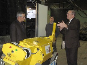 Sudbury Star file photo
Greg Baiden takes FedNor Minister Tony Clement on a tour of Penguin Automated Systems Inc. in January, 2013.