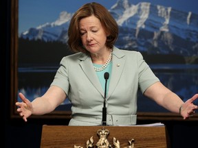 Alberta Premier Alison Redford announces that she will pay back the costs associated with some personal uses of government aircraft, during a press conference at the Alberta Legislature on Tuesday. (DAVID BLOOM/EDMONTON SUN)