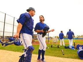 Blue Jays catcher (left) Erik Kratz has been behind the plate for both of R.A. Dickey's spring training starts. (USA Today/photo)
