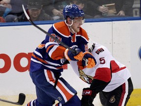 Oilers winger Ales Hemsky collides with Senators’ Cody Ceci during the first period of Tuesday's game Rexall Place. (David Bloom, Edmonton Sun)