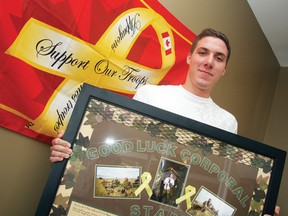 Cpl. Justin Stark is pictured with one of the farewell presents he received from his home unit before leaving for a seven-month long tour in Afghanistan in May 2010. Stark died at Hamilton's John W. Foote VC Armouries on October 29, 2011. (MATT DAY/QMI Agency Files)