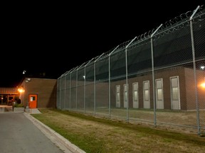 A high fence lines the outside of the Elgin-Middlesex Detention Centre in London, Ont., on July 25, 2012. (CRAIG GLOVER/QMI Agency Files)