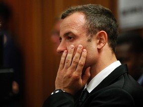 Track star Oscar Pistorius sits in the dock on the third day of his trial for the murder of his girlfriend Reeva Steenkamp at the North Gauteng High Court in Pretoria, March 5, 2014. (REUTERS/Mike Hutchings)