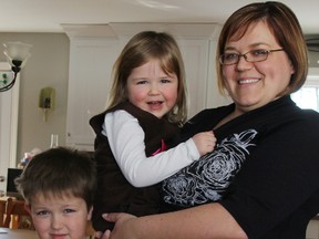 Hanneke Mills poses with her children Katie, 4, and Jarod, 7. The Brigden-area family relies on Ronald McDonald House Charities in London when Katie, who has a tethered spinal cord, needs to visit a doctor or have surgery. (TYLER KULA, The Observer)