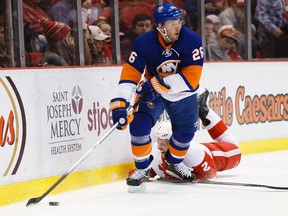 Former New York Islanders left wing Thomas Vanek (26) skates with the puck as Detroit Red Wings defenceman Brendan Smith (2) falls to the ice in the third period at Joe Louis Arena earlier this season. (Rick Osentoski-USA TODAY Sports)