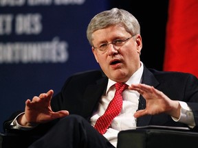 Canada's Prime Minister Stephen Harper speaks at the Prospectors and Developers Association of Canada Convention in Toronto, Ontario, March 3, 2014. (REUTERS/Aaron Harris)