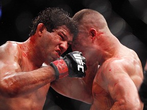 Gilbert Melendez (left) fights Diego Sanchez. (Andrew Richardson, USA Today Sports)
