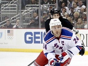 The Rangers traded their captain Ryan Callahan to the Lightning for Martin St. Louis. (USA Today/photo)