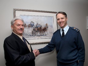 James Keirstead (left) Royal Military College Commandant Brig.-Gen. Al Meinzinger with one of Keirstead's paintings that's being donated to the Royal Military College. 
IAN MACALPINE/KINGSTON WHIG-STANDARD/QMI AGENCY