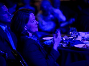 Alberta premier Alison Redford applauds as mayor Don Iveson delivers the State of the City speech at the Shaw Conference Centre in Edmonton, Alta., on Wednesday, March 5, 2014. Codie McLachlan/Edmonton Sun/QMI Agency