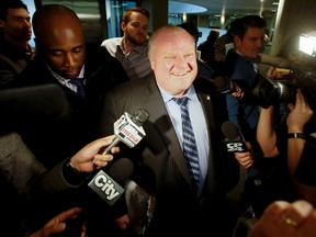 Toronto Mayor Rob Ford arrives at City Hall after news broke of Toronto Police bringing the OPP into Project Brazen 2 on March 5, 2014. (Stan Behal/Toronto Sun)