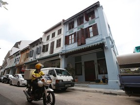 A general view of the home (in blue) of Autumn Radtke, chief executive of First Meta Pte Ltd, in Singapore March 6, 2014. Singapore police are investigating the apparent suicide of the 28-year-old American woman who ran a small exchange in the Asian city state trading virtual currencies. REUTERS/Edgar Su