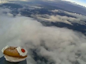 A cannolo made with a polymer clay material is pictured travelling through the stratosphere in this YouTube video screengrab.