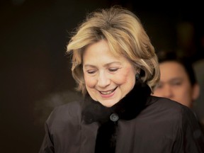 Former first lady Hillary Clinton leaves the Palliser Hotel in Calgary, Alta., on Thursday March 6, 2014. She was on her way to deliver a keynote address for the Global Perspectives Series at the Telus Convention Centre. Lyle Aspinall/Calgary Sun/QMI Agency