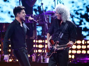 Singer Adam Lambert (L) performs with Queen's guitarist Brian May during the iHeartRadio Music Festival at the MGM Grand Garden Arena in Las Vegas, Nevada September 20, 2013. REUTERS/Steve Marcus