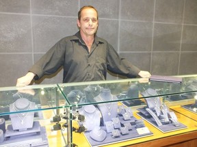 Duane Bock shows off some of the sparking diamonds at his Hyde Park business, Gordons Gold Jewellers.