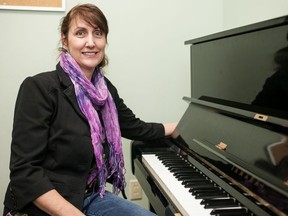 Angela Weninger, co-owner of Academy of Music is pictur ed in one of their instruction rooms at their Hyde Park Rd. Weninger star ted teaching there when she was a student at Western University.