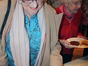 Gale Speirs loads up her plate at the St. John’s Anglican Church Pancake Day feast.