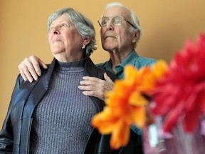 Maxine Myers and her husband Eugene Weber pose for a photo in their home in Ottawa Thursday March 6,  2014. War veteran Eugene Weber is upset  the government isn't doing enough to allow them to attend D-Day anniversary events this summer. Tony Caldwell/Ottawa Sun