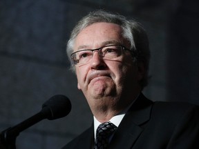 Canada's Chief Electoral Officer Marc Mayrand pauses while speaking to journalists after testifying before the Commons procedure and House affairs committee on Parliament Hill in Ottawa March 6, 2014. (REUTERS/Chris Wattie)