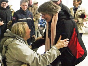 Karen Cassidy, a victim of the violence on Feb. 26 near Tamworth, shares a hug with the woman who saved her life by intervening in the violent attack that resulted in Cassidy's broken ankle. The two women were among nearly two hundred Tamworth area residents who gathered to walk through the town and show support to one another following the tragic events one week earlier.