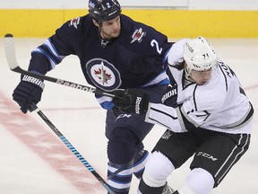 Winnipeg Jets defenceman Adam Pardy (l) and Los Angeles Kings center Jordan Nolan tangle during NHL hockey in Winnipeg, Man. Thursday, March 06, 2014.
Brian Donogh/Winnipeg Sun/QMI Agency