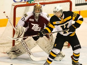 Kingston Frontenacs forward Spencer Watson tries to deflect the puck in front of Petes goalie Andrew D'Agostini during an Ontario Hockey League game in Peterborough Thursday night. The Petes won 5-4 in overtime. (Clifford Skarstedt/QMI Agency)