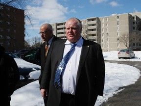 Toronto Mayor Rob Ford is pictured Thursday during a visit to a building in Etobicoke. (STAN BEHAL, Toronto Sun)