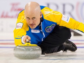 Team Alberta skip Kevin Koe delivers a stone in the 2nd end against Team Prince Edward Island during the 2014 Brier curling championship in Kamloops, B.C., March 6, 2014. (BEN NELMS/Reuters)