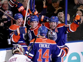 The Edmonton Oilers celebrate Ryan Smyth's third-period goal against the New York Islanders Thursday at Rexall Place. (David Bloom, Edmonton Sun)