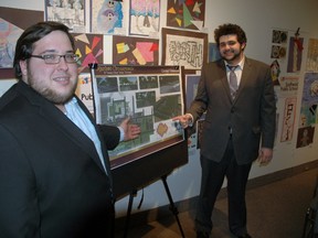 Fanshawe College landscape design student Ben Warner, left, and GIS and urban planning student Moe Sefian stand with a portion of their design for a section of Talbot St. in St. Thomas on Thursday. They were members of an award-winning group in a design process aimed at generating ideas about how to revitalize Talbot St. (Ben Forrest, Times-Journal)