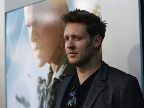 Director Neill Blomkamp poses at the world premiere of his movie "Elysium" in Los Angeles, California Aug. 7, 2013.  REUTERS/Mario Anzuoni