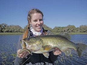 Ashley Rae with a largemouth bass caught and released on Lake Kissimmee in Florida. (Supplied photo)