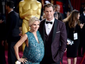 Actor Christ Hemsworth (R) and Elsa Pataky attends the Oscars held at Hollywood & Highland Center on March 2, 2014 in Hollywood, California. (Michael Buckner/Getty Images/AFP)