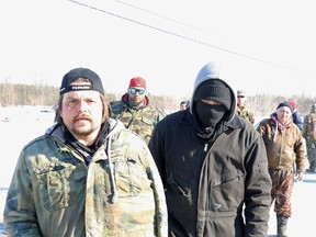 Protesters approach Intell reporter Jason Miller.