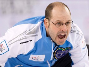 Team Quebec skip Jean-Michel Menard guides his rock in the 9th end against team Alberta during their draw during the 2014 Tim Hortons Brier curling championships in Kamloops, British Columbia March 7, 2014.   (REUTERS)