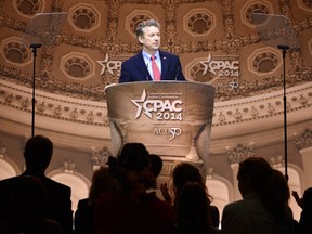 Senator Rand Paul (R-KY) pauses in his remarks as guests applaud at the Conservative Political Action Conference (CPAC) in Oxon Hill, Maryland, March 7, 2014. (REUTERS/Mike Theiler)