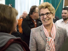 Kathleen Wynne spoke to several people while touring the  76th Annual London Farm Show at the Western Fair Agriplex in London, Ont. on Friday March 7.DEREK RUTTAN/The London Free Press/QMI Agency