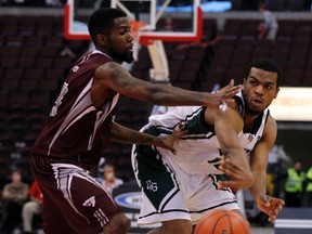University of Ottawa GeeGees' Terry Thomas, left, defends University of Saskatchewan Huskies' Dadrian Collins, right, during the first half of the CIS basketball final 8 tournament at the Canadian Tire Centre in Ottawa, Ont. on Friday March 7, 2014. Darren Brown/Ottawa Sun/QMI Agency