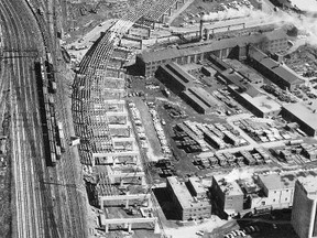 A full half century after this aerial view was taken by a Toronto Telegram newspaper photographer that shows construction of the extension of the Gardiner Expy. from its York St. intersection to the new Don Valley Pkwy. at Bloor St., politicians, planners and the public discuss the future of this very stretch of the expressway. The large complex at the centre of the photo is the Canadian Iron Foundry (Canron) factory on the west side of Cherry St. south of Lake Shore Blvd. East. The numerous white storage tanks are those of B-A gasoline (renamed Gulf in 1969). At the top right is the Keating Channel at the mouth of the Don River and Villiers St. in the Ashbridge’s Bay Terminal District (now the Port Lands).