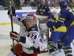 Russia's Evgeny Kuznetsov (L) celebrates after scoring against Sweden during their Euro Hockey Tour ice hockey match in Brno April 28, 2012.    (REUTERS)