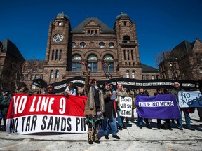 People protest the National Energy Board's approval to reverse the flow of the Enbridge oil pipeline "Line 9" at Queen's Park in Toronto, March 7, 2014.   REUTERS/Mark Blinch