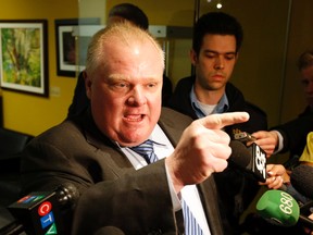 Toronto Mayor Rob Ford lashes out at Toronto Police Chief Bill Blair last Thursday, demanding Blair apologize for wasting valuable resources in maintaining surveillance on Ford. On another issue, Blair said he was disgusted by insulting comments about him by Ford, which were captured on video. 
MICHAEL PEAKE/TORONTO SUN