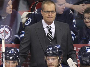 Winnipeg Jets coach Paul Maurice grits his teeth during a second-period timeout as the Jets trailed the Ottawa Senators 5-2 during NHL action at MTS Centre in Winnipeg, Man., on Sat., March 8, 2014. Kevin King/Winnipeg Sun/QMI Agency