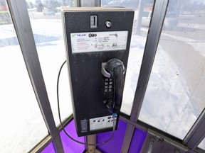 A Telus pay phone at the corner of 101 Avenue and 75 Street, in Edmonton, Alta., on Monday Feb. 24, 2014.  David Bloom/Edmonton Sun/QMI Agency