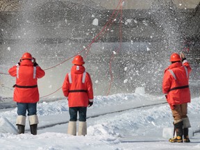 Ottawa city crews were blasting ice on the Rideau River near the dam on Sussex Drive in Ottawa On. Saturday March 8,  2014. Every year the city of Ottawa frees up the ice near the dam which stops flooding furter up the river.    Tony Caldwell/Ottawa Sun/QMI Agency