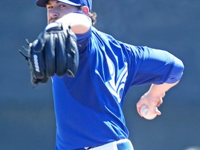 Blue Jays pitcher Drew Hutchison winds up during Saturday’s exhibition game against the Minnesota Twins in Dunedin. The young right-hander tossed three strong innings. (Veronica Henri, Toronto Sun)